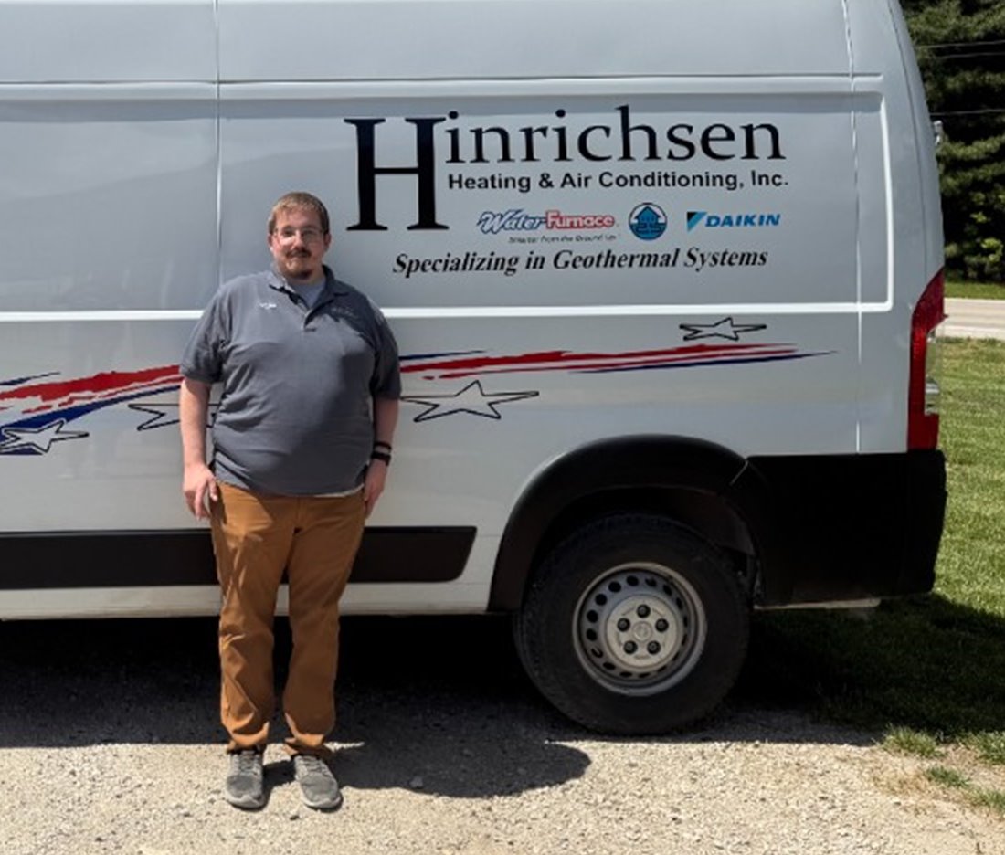 Mitch Hinrichsen in front of a Hinrichsen Heating & Air Conditioning service van